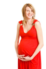 Beautiful pregnant woman in red dress on white