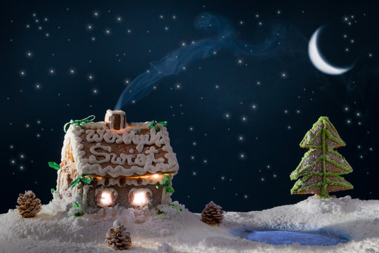 Blue Smoke Poured Out Of The Gingerbread Home At Night In Winter