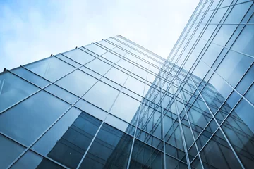 Foto op Plexiglas transparent glass wall of office building © Vladitto