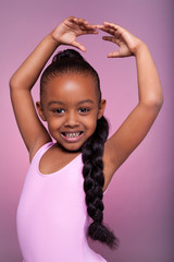 Cute little African American girl dancing