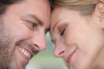 Couple with heads together