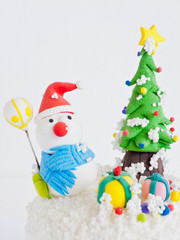 Obraz na płótnie Canvas Snowmen on a cold winter with snowflake - Christmas decoration.