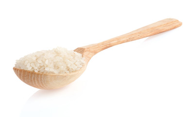 rice grain in wooden spoon