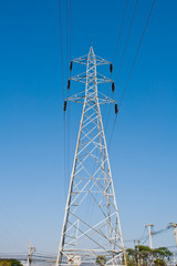 High voltage power pole on blue sky