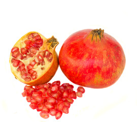 fresh pink pomergranate isolated on white background