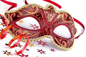 Red carnival mask with confetti and streamer