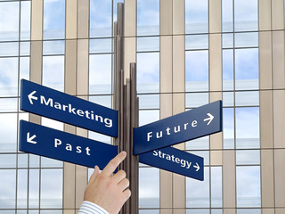 Fototapeta premium Decisions direction signs with office building in background