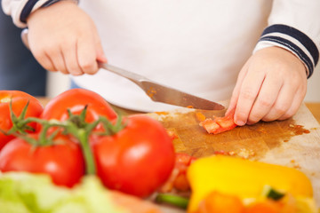 Child making salad