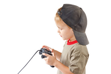 Little boy plays with a joystick on a white background © Boris Bulychev