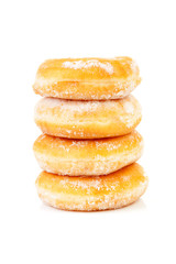 four stacked sugared delicious donuts