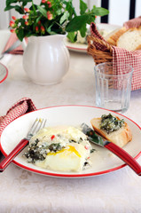 Baked eggs with spinach and focaccia