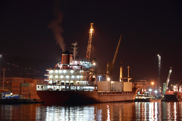 commercial ship in harbor at night - 37197587