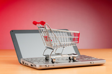 Internet online shopping concept with computer and cart