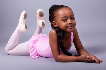 Cute little African American girl wearing a ballet costume - Powered by Adobe