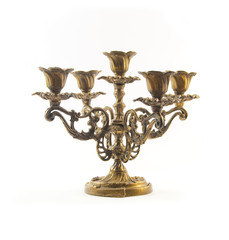 Fototapeta na wymiar Beautiful candlestick with five arms in golden and bronze colors