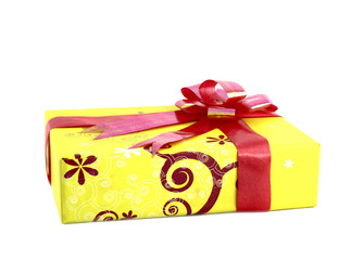 yellow gift box with red ribbon isolated on white background