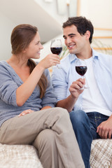 Portrait of a couple having a glass of red wine