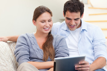 Young couple using a tablet computer