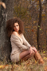 woman sitting near a tree