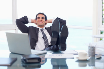 Satisfied businessman relaxing