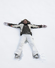 Fototapeta na wymiar girl having fun in the snow