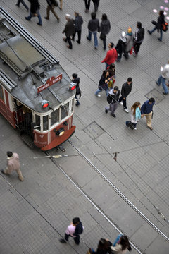 Tram and walking people on Istiklal Street