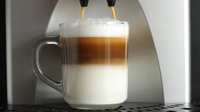 coffe dispenser with cup of coffee  cappuccino