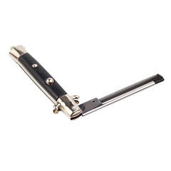 Metal folding comb in the shape of a knife isolated on white bac