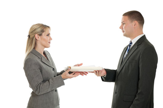 Business people passing a folder isolated on white