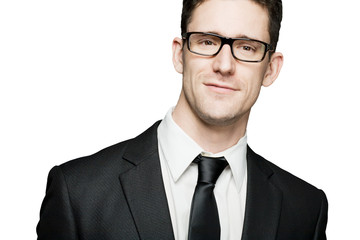 Young businessman in black suit expressing positivity. Isolated.
