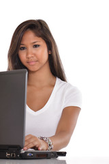 Naklejka premium Young Asian woman typing on a laptop