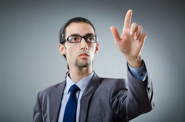 Businessman pressing virtual buttons