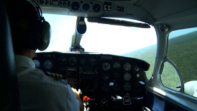 Pilot in Cockpit of Light Aircraft 