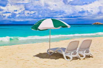 Chairs and umbrella at tropical beach