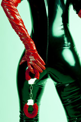 detail of standing woman with handcuffs
