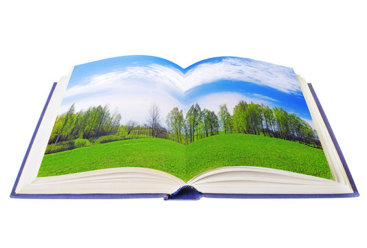 Open book with green meadow isolated