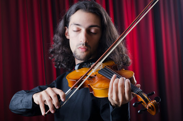 Young violin player playing