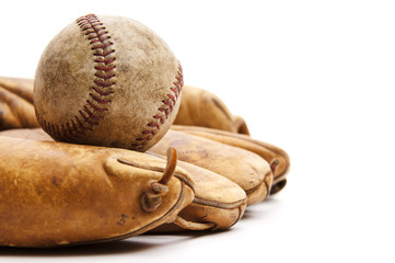 Vintage baseball glove and ball isolated on white