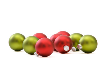 Red and green christmas ornaments isolated on white