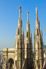 Fototapeta na wymiar gothic spires on roof of Duomo (cathedral), Milan, Italy