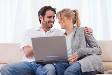 Young couple using a laptop