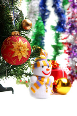 Snowman on the background of Christmas decorations