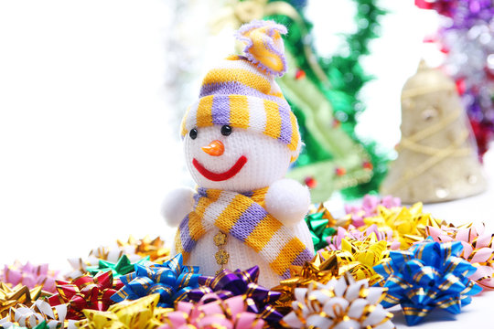 Snowman on the background of Christmas decorations