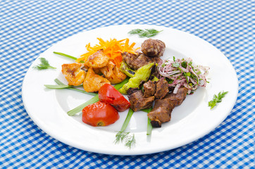 Plate with tasty lamp kebabs