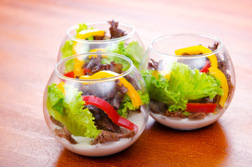 Fototapeta na wymiar Fresh healthy salad in bowls
