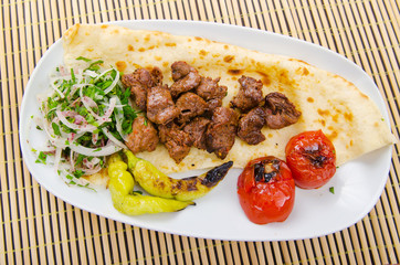 Kebab served in the plate