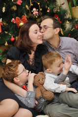 family near the Christmas-tree