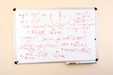 formulas on a whiteboard