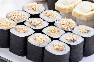 Closeup japanese sushi on a white plate. Sushi set