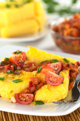 Polenta slices with Hogao, a Colombian salsa